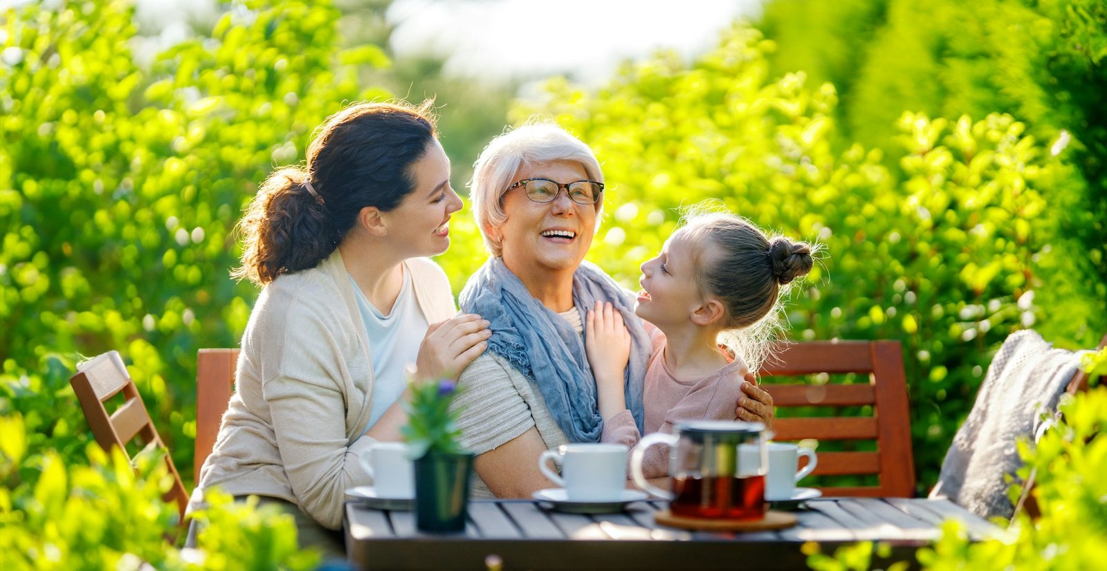family drinking tea in the garden