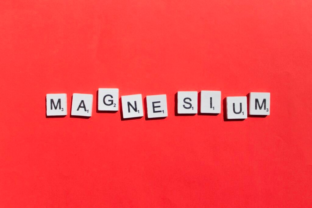 Magnesium scrabble letters word on a red background